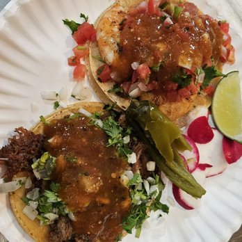 Tacos Sinaloa - Shrimp and pastor taco - Two tacos with meat, salsa, chopped onions, cilantro, and garnishes like lime and radish on a paper plate. - Mexican Near Me - Berkeley, California