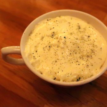 Little Wolf - a bowl of mashed potatoes on a wooden table - Canadian (New) Near Me - Edmonton, Alberta Little Wolf - a bowl of mashed potatoes on a wooden table - Canadian (New) Near Me - Edmonton, Alberta