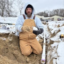 Valiant Contracting - Installing a drain field