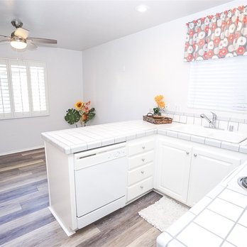 EN Design and Build - a kitchen with white appliances - Interior Design Near Me - San Diego, California EN Design and Build - a kitchen with white appliances - Interior Design Near Me - San Diego, California