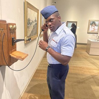 Briscoe Western Art Museum - Old time phone w. Airmen Sadiq M. - Art Museums Near Me - San Antonio, Texas