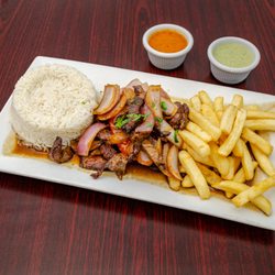Al Toque Peruvian Restaurant - Lomo Saltado - One of our popular dishes amongst meat lovers! Combining Peruvian and Asian flavors
