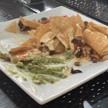 Skye Bar & Grille - Remnants of the cheesesteak nachos... delicious! Next time I want to ask for extra cheese sauce - Bars Near Me - Ocean City, Maryland Skye Bar & Grille - Remnants of the cheesesteak nachos... delicious! Next time I want to ask for extra cheese sauce - Bars Near Me - Ocean City, Maryland
