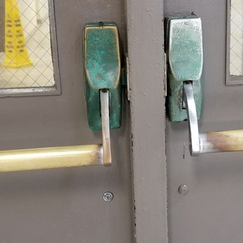 Mt. Trashmore Family YMCA - Green rust on the door handles leading to the main area of the Y from the pool - Child Care & Day Care Near Me - Virginia Beach, Virginia