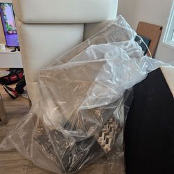Each piece is wrapped in cardboard and plastic for safe transport.