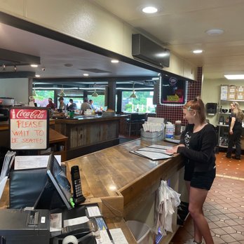 Road Hawg BBQ Swine Dining - a woman standing at the counter - Food Trucks Near Me - Gorham, New Hampshire Road Hawg BBQ Swine Dining - a woman standing at the counter - Food Trucks Near Me - Gorham, New Hampshire