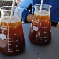Distilled Beauty Bar & Social House - Iced Americanos. Creamy texture, just delicious. Hario glass (for here) and paper straws=sustainable coffee.