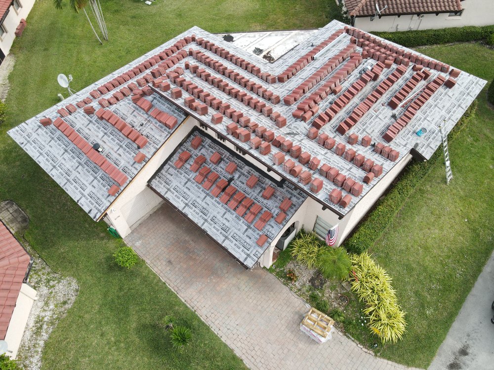 Slide of TJ Platinum Roofing