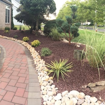 Cisnes Landscaping - a front yard with a brick walkway - Landscaping Near Me - Hightstown, New Jersey