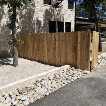 Ramirez Landscaping & More - a wooden fence in front of a house - Landscaping Near Me Ramirez Landscaping & More - a wooden fence in front of a house - Landscaping Near Me