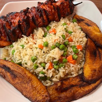 Suya Hut - Chicken suya skewer with coconut rice and plantains - African Near Me - Houston, Texas Suya Hut - Chicken suya skewer with coconut rice and plantains - African Near Me - Houston, Texas