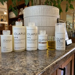 Nancy's Hair Design - We have the whole OLAPLEX family here. Come in and experience an OLAPLEX treatment today.
