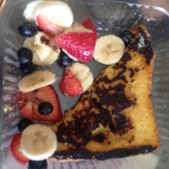 Cyrano's Caffe - Burnt French toast, it was hidden under my other less burnt piece. Disappointing to say the least. - Coffee & Tea Near Me - Orange, California