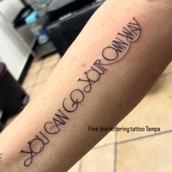 Angel Tattoo - Fine line lettering tattoo at angel tattoo shop in Tampa by female tattoo artist Laetitia Coleman walk-ins welcome for small tattoos