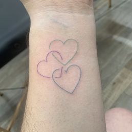 My fine line triple heart tattoo by Kenny