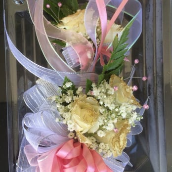 Kimmie's Floral Design - White roses glitter dipped in gold glitter with pink crystals and white and pink ribbons! - Floral Designers Near Me