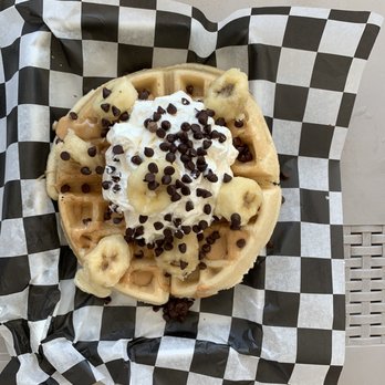 The Modern Waffle - a waffle topped with whipped cream and chocolate chips - Waffles Near Me The Modern Waffle - a waffle topped with whipped cream and chocolate chips - Waffles Near Me