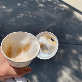 Starbucks - a person holding a cup of coffee - Coffee & Tea Near Me - Chelsea, Massachusetts