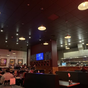 Zeeks Pizza - people sitting at tables in a restaurant - Pizza Near Me - Bellevue, Washington Zeeks Pizza - people sitting at tables in a restaurant - Pizza Near Me - Bellevue, Washington