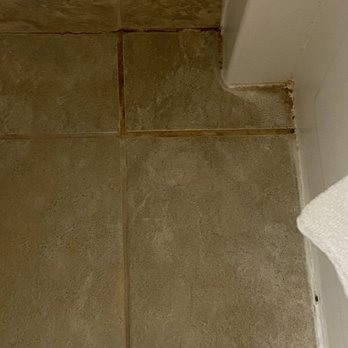 Waikiki Malia - Bathroom tile next to the bathroom hasn't been cleaned in a long time! - Hotels Near Me - Honolulu, Hawaii Waikiki Malia - Bathroom tile next to the bathroom hasn't been cleaned in a long time! - Hotels Near Me - Honolulu, Hawaii