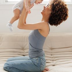 Yummy Mummy - Mom holding her baby.