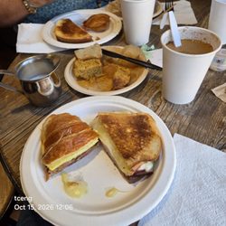 The Story Caffe - Egg bacon croissant, ham and Havarti sandwich, pumpkin streisel and blueberry miff8ns, coffee.