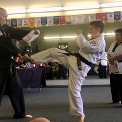 Southern California Taekwondo Academy - Breaking boards during testing for advanced belt.