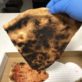 Mad Pie - Ordered three pies cheese, buffalo, and fungo(mushroom) two pie all burnt. I can believe they gave me this. - Pizza Near Me - Honolulu, Hawaii