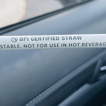 Starbucks - a hand holding a cigarette in a car - Coffee & Tea Near Me - Apopka, Florida