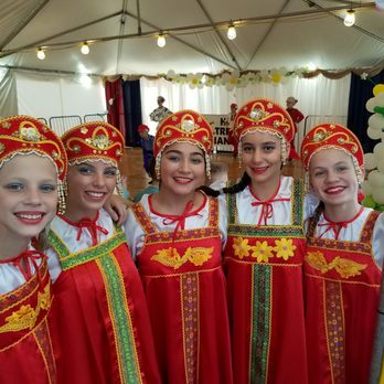 Holy Trinity Russian Festival - Romashka Dance Ensemble girls are waiting while boys on stage - Festivals Near Me - Baltimore, Maryland