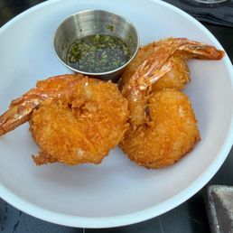 Coconut Shrimp -
Black tiger prawns, coconut, tempura batter, honey-lime chipotle sauce Coconut Shrimp -
Black tiger prawns, coconut, tempura batter, honey-lime chipotle sauce
