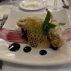 Capri - Deepfried Zucchini blossoms stuffed with Gouda and ricotta cheese,, with saffron wafer and balsalmic reduction.