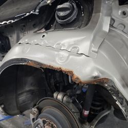 Dave Orr's Auto Body - The panel is off, it shows where the rust was spreading rapidly underneath.