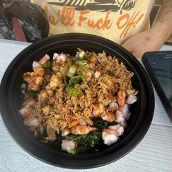 Shrimp, green onions, seaweed salad and crunchy onions with sushi rice and sweet soy sauce