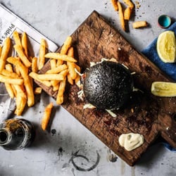 The Fish & Chippery by The Atlantic - Miso Marinade Rockling on a Squid Ink Brioche Bun. Photo from website