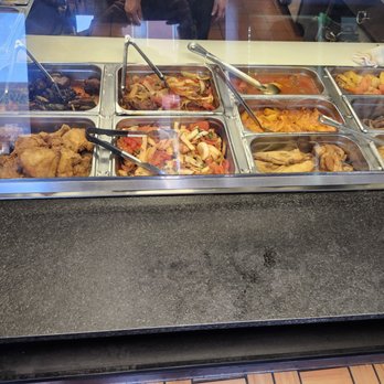 Perla de Oriente Kitchen - Dishes at the front of the kitchen for quick service - Fast Food Near Me - Trenton, New Jersey