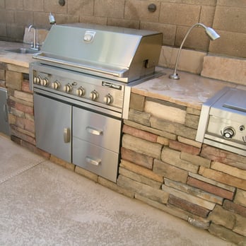 Desert Showcase Landscaping - This BBQ built around cart. Large unit with lighting built into wall, sink, side burner, and veneer stone - Landscaping Near Me