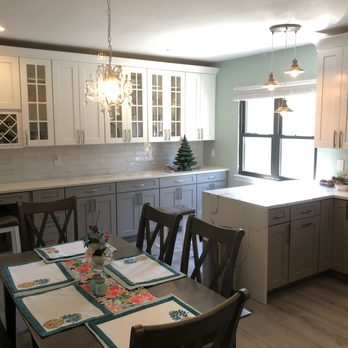 MIDCO Renovations - a kitchen with a table and chairs - General Contractors Near Me - Jackson Hts, New York MIDCO Renovations - a kitchen with a table and chairs - General Contractors Near Me - Jackson Hts, New York