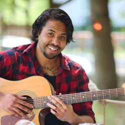 Eli Samuel - Kingsley playing the guitar