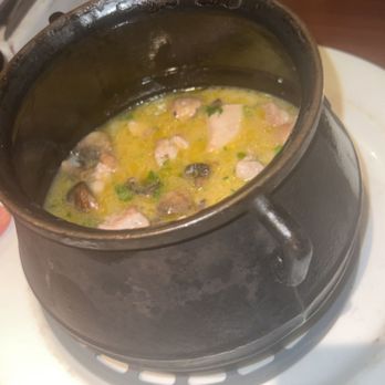Rigo - Boyfriend loved it. Hearty mushroom, rice and chicken dish served in hot kettle bowl - Spanish Near Me - Honolulu, Hawaii