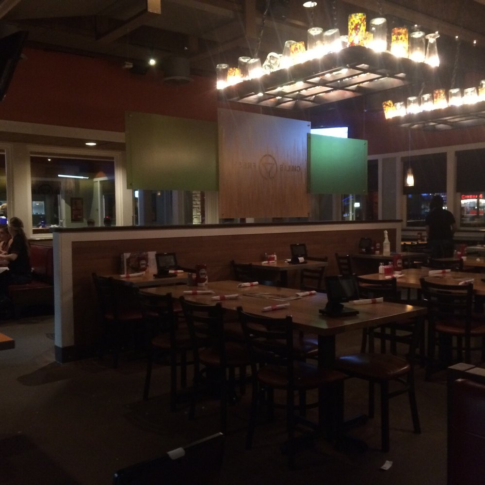 a dining area with tables and chairs a dining area with tables and chairs