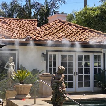 Mr. Mister - a woman washing a pool - Misting System Services Near Me Mr. Mister - a woman washing a pool - Misting System Services Near Me