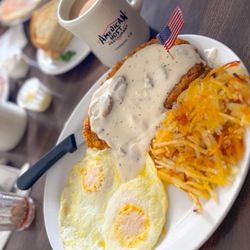 American Host Restaurant - Chicken fried steak with eggs and hash-browns, delicious!