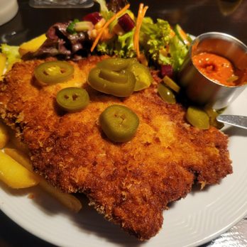 Hüsi Bierhaus - Spicy Schnitzel with salsa and jalapeños - International Near Me - Interlaken, BE Hüsi Bierhaus - Spicy Schnitzel with salsa and jalapeños - International Near Me - Interlaken, BE