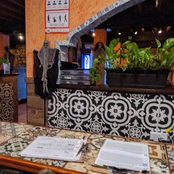 Casa Tequila - a table with a menu on it - Mexican Near Me - Salem, Massachusetts