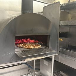 One of the pizza ovens. Using wood now which makes the pizza taste amazing