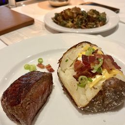 Half filet and loaded baked potato with Brussel sprouts
