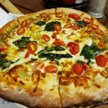 Mangia Mangia - Spinach, cherry tomato, mottzarella with garlic sauce. Yummmmmmm - Italian Near Me - Spencerport, New York Mangia Mangia - Spinach, cherry tomato, mottzarella with garlic sauce. Yummmmmmm - Italian Near Me - Spencerport, New York