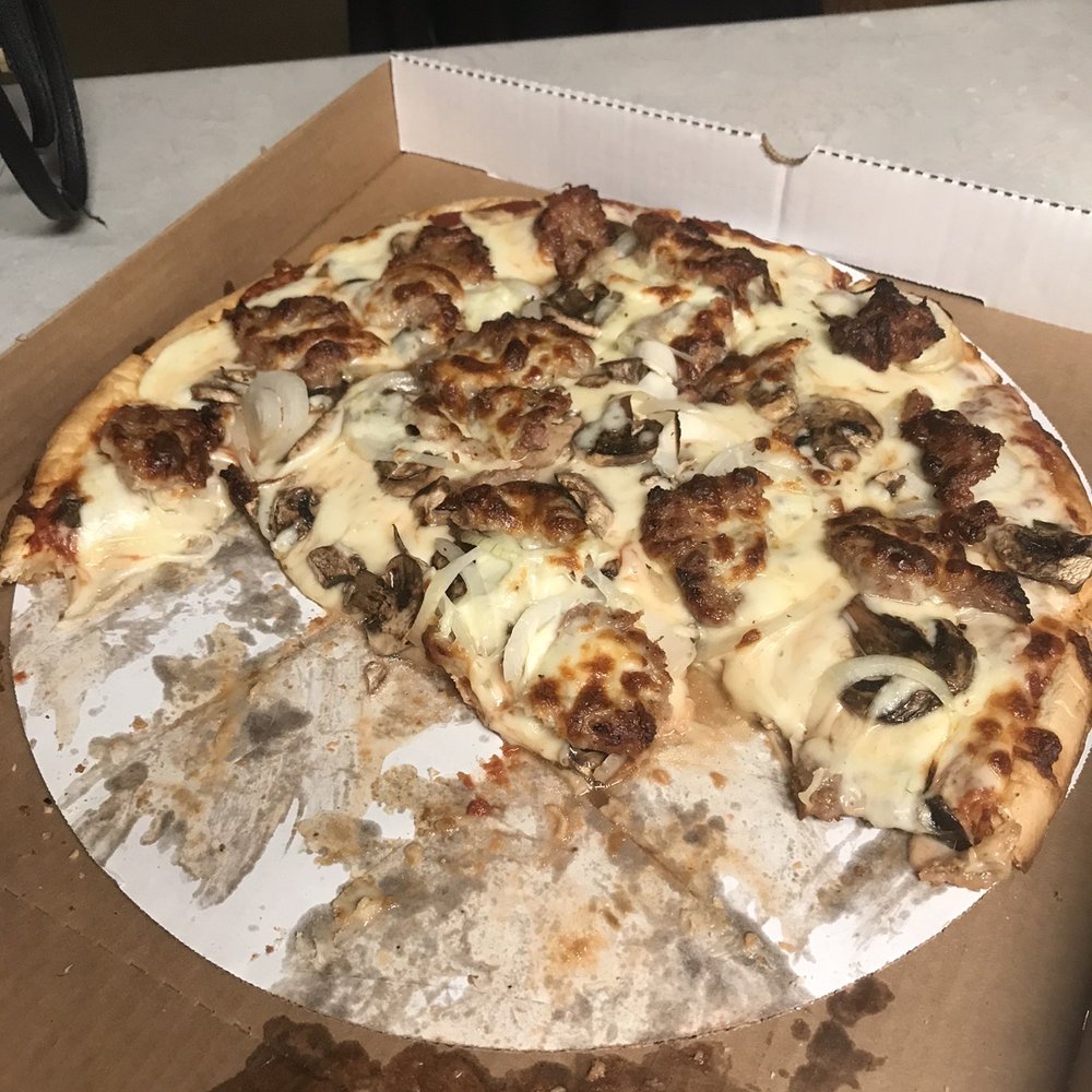 Cheese, sausage, fresh sliced mushrooms and onions!  Crispy thin crust!  This is what was left after two of us were full!