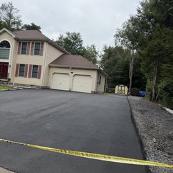 Cooper Asphalt - Had a drainage pipe installed and added some area and resurfaced entire driveway